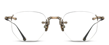 Pair of rimless glasses with an ornate gold frame on a white background