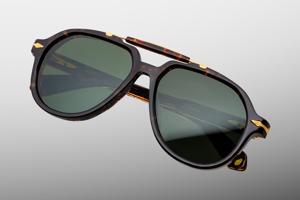Dark brown tortoiseshell aviator with a bold brow bar and dark green lenses