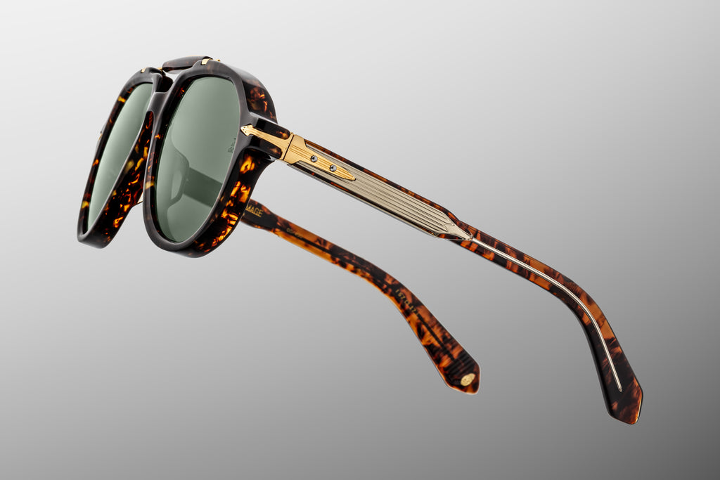 Brown tortoiseshell aviator sunglasses with green lenses and mixed gold and silver hardware