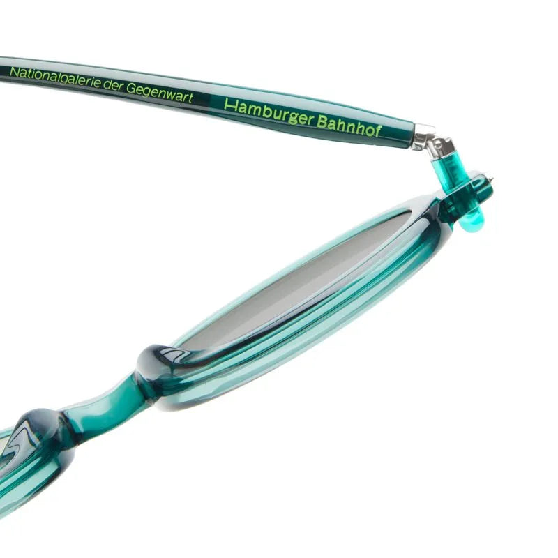 Teal sunglasses with a reflective surface on a white background