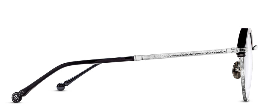 Side profiles of eyeglasses with navy acetate and detailed rose gold metal sides on a white background