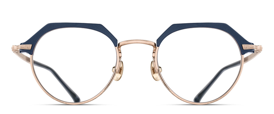 Round eyeglasses with a rose gold frame and navy acetate accents on a white background