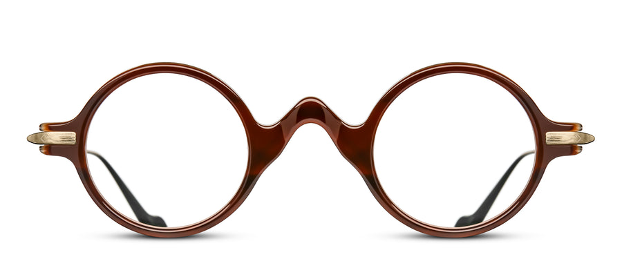 Round eyeglasses with a brown crystal frame with a quirky pointed bridge, on a white background