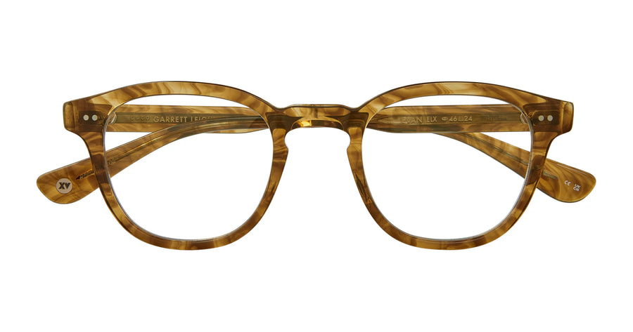 Brown tortoiseshell eyeglasses on a white background