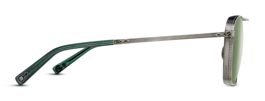 Profile of antique silver metal sunglasses with ornate details and green lenses.